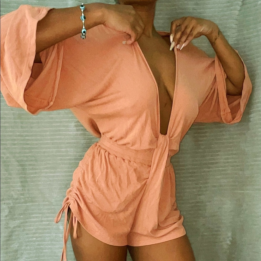 Beautiful peach colored size small flare romper.